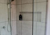 Shower with frameless shower screen