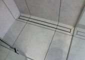 Tiled shower floor with tiled grate